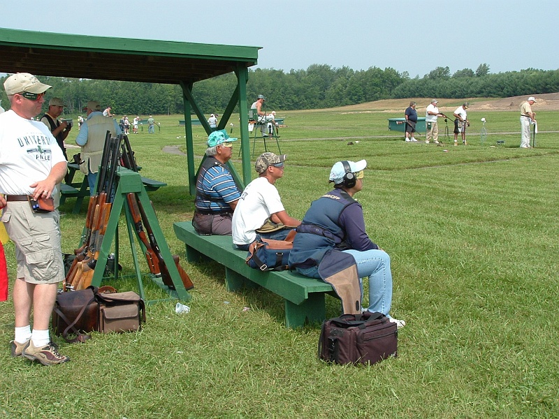 dscf0023e.jpg - Kay Ohye, Debbie Ohye Nielson and Don Nielson shot on the flight in front of us during the singles championship on Saturday. You wanna see concentration and preparation before going out to shoot? You watch this squad. Chad Landon is on the left and Brandon Capitano is sitting between Debbie and Kay.